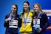 Gold medalist Kaylee McKeown of Australia, center, silver medalist Regan Smith, left, of the U.S. and bronze medalist Katharine Berkoff of the U.S. at