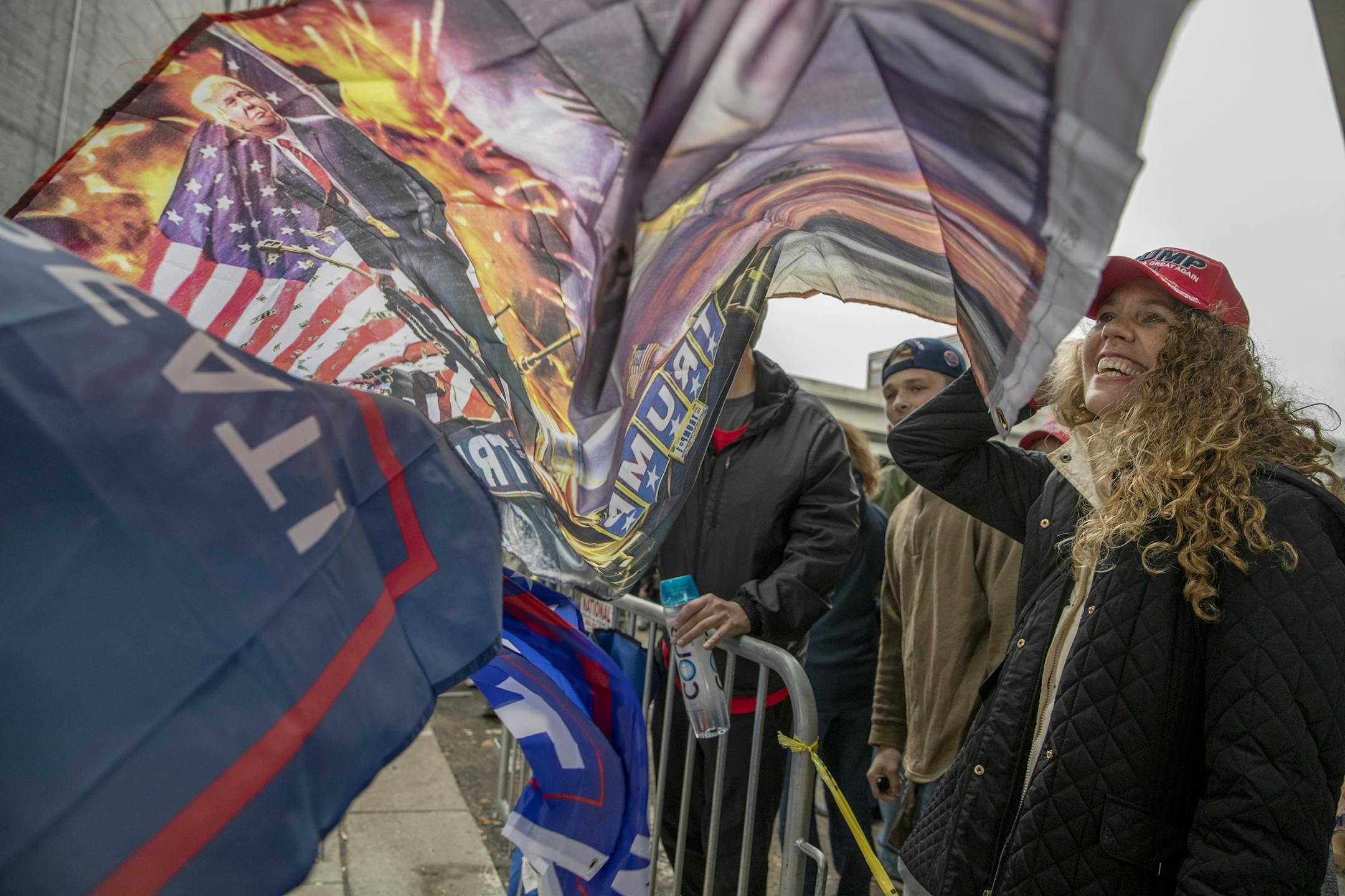 Trump supporters waited in the rain to get into the Target Center from 5th Street North, for President Trump's visit, Thursday, October 10, 2019 in Minneapolis, MN.