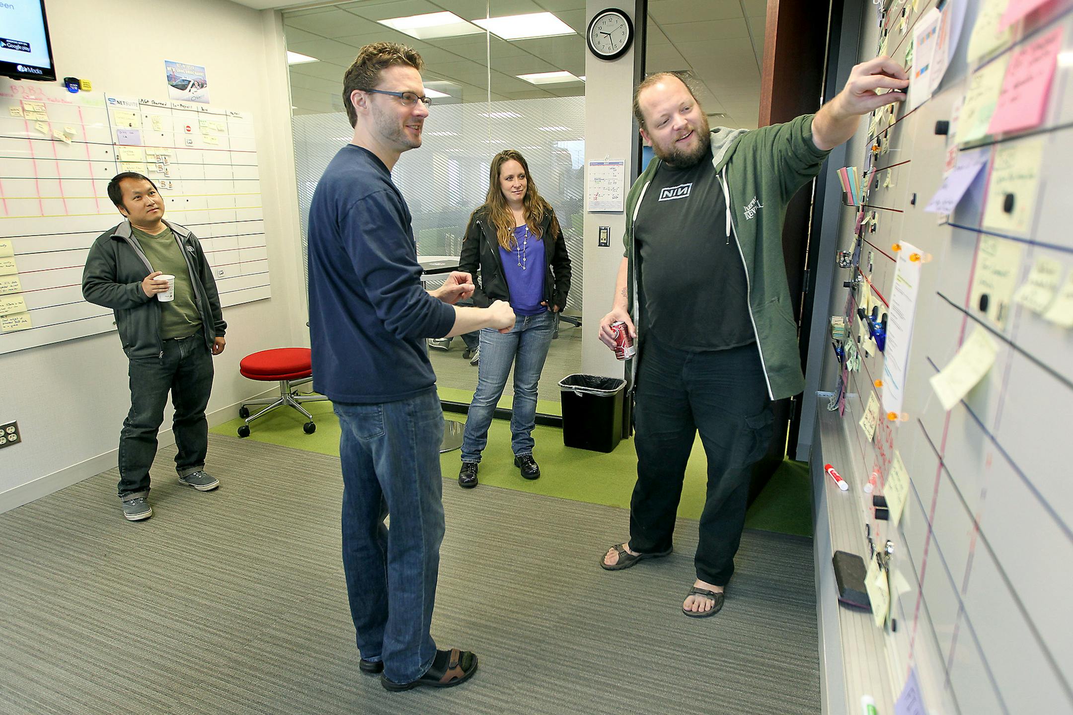 SPS Commerce employees hold their daily morning meeting at the company's downtown Minneapolis headquarters. (ELIZABETH FLORES/Star Tribune file photo)