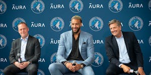 Timberwolves center Rudy Gobert, President of Basketball Operations Tim Connelly, left, and head coach Chris Finch, right, after Gobert was traded to 