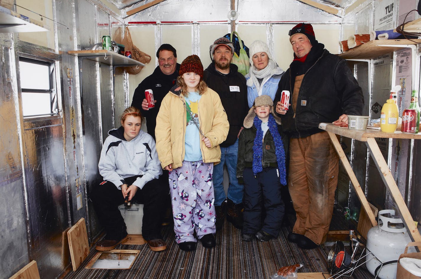 Minneapolis Institute of Arts "Untitled [Minneapolis. Winter Games. Ice Fishing. Left to right: Tabby Allers, Neil Frandsen, Sammy Diemert, Dan Diemert, Casi Diemert, Gabrielle Diemert, and Joe Johnson.]," 2012 Martin Parr (United States, North America) Pigment print 40 x 60 in. (101.6 x 152.4 cm) The Christina N. and Swan J. Turnblad Memorial Fund 2012.46.4 &#xa9; Martin Parr, courtesy Janet Borden, Inc., NY ORG XMIT: 114173