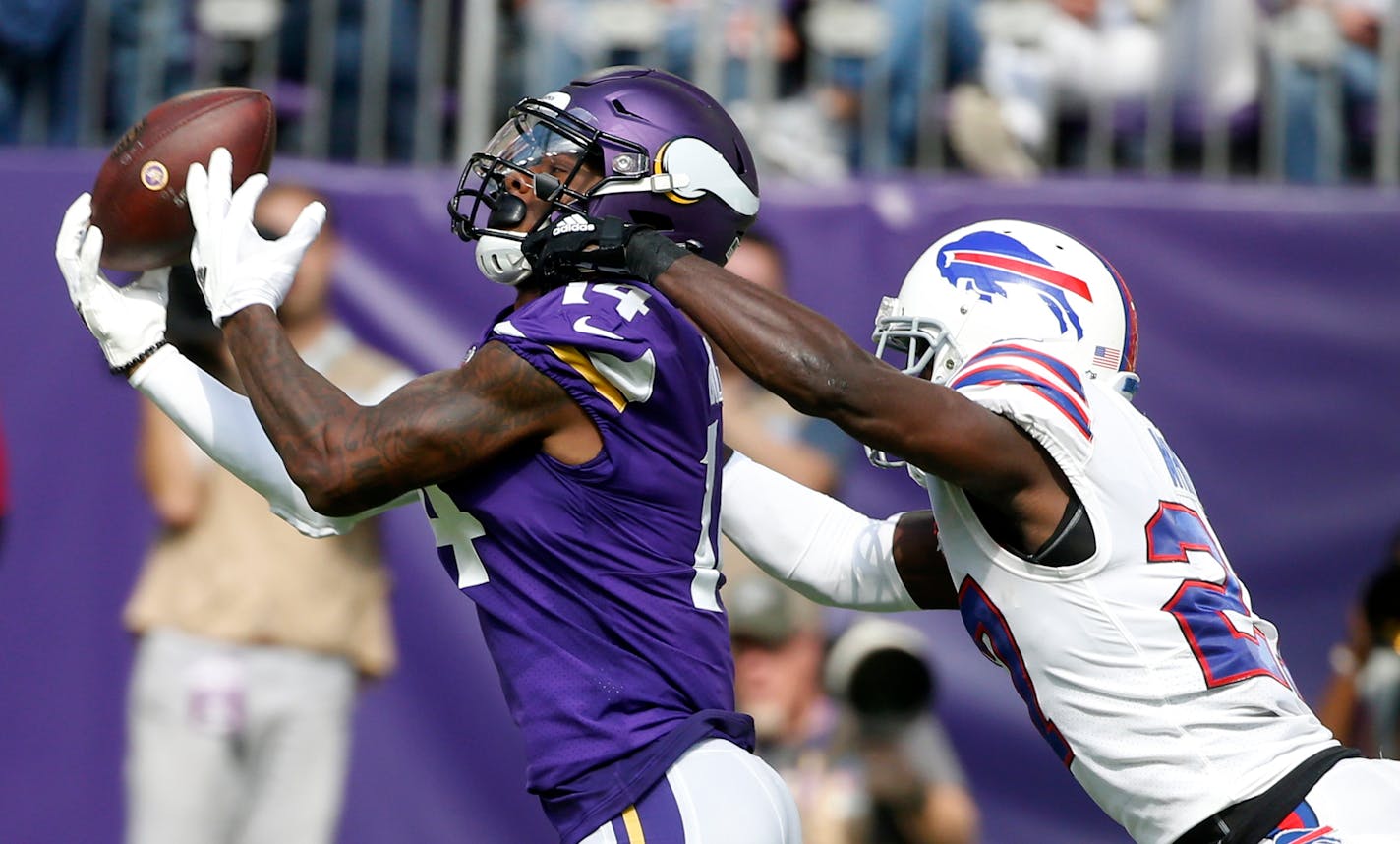 Bills cornerback Tre'Davious White, right, breaks up a pass intended for Vikings wide receiver Stefon Diggs