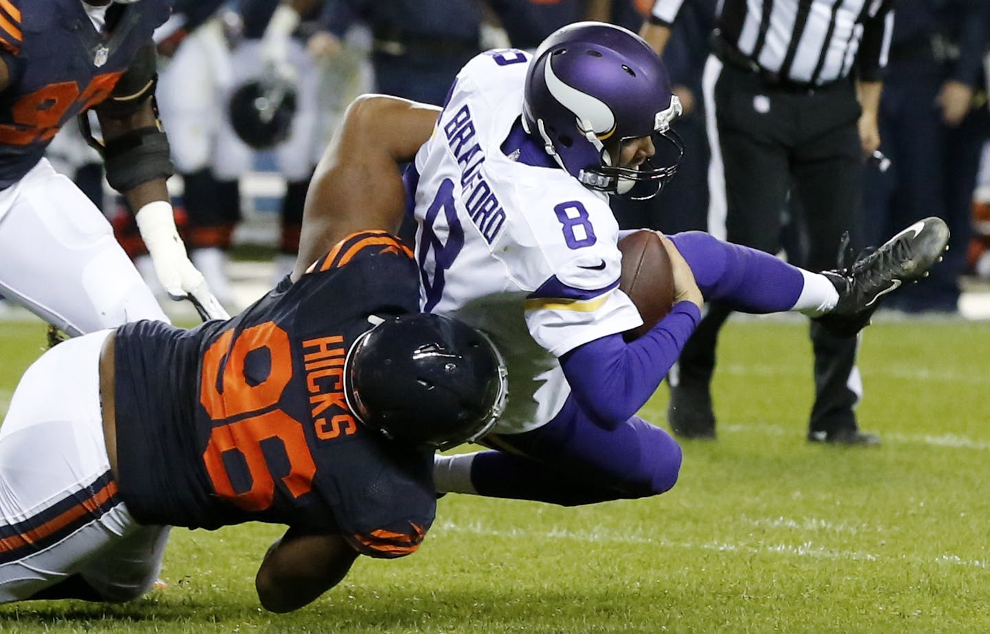 Chicago Bears defensive end Akiem Hicks (96) sacks Minnesota Vikings quarterback Sam Bradford (8) during the first half of an NFL football game in Chicago, Monday, Oct. 31, 2016. (AP Photo/Charles Rex Arbogast)