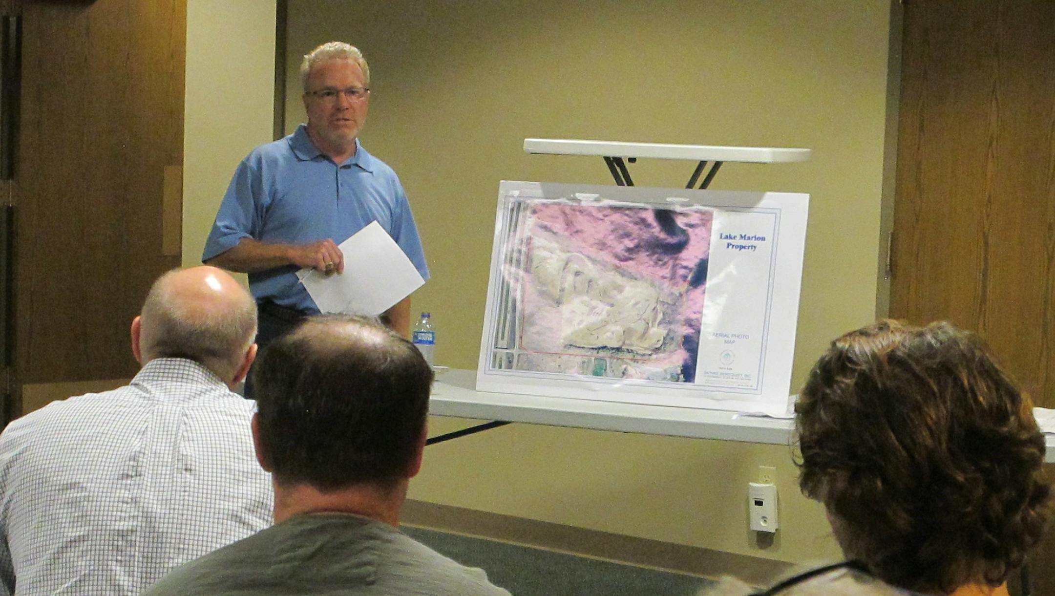 Susan Feyder * susan.feyder@startribune.com Blair Bury, president of Midwest Asphalt Corp., spoke on Tuesday at a neighborhood meeting about the proposal to haul gravel 24 hours a day at the company's gravel mine in Lakeville.