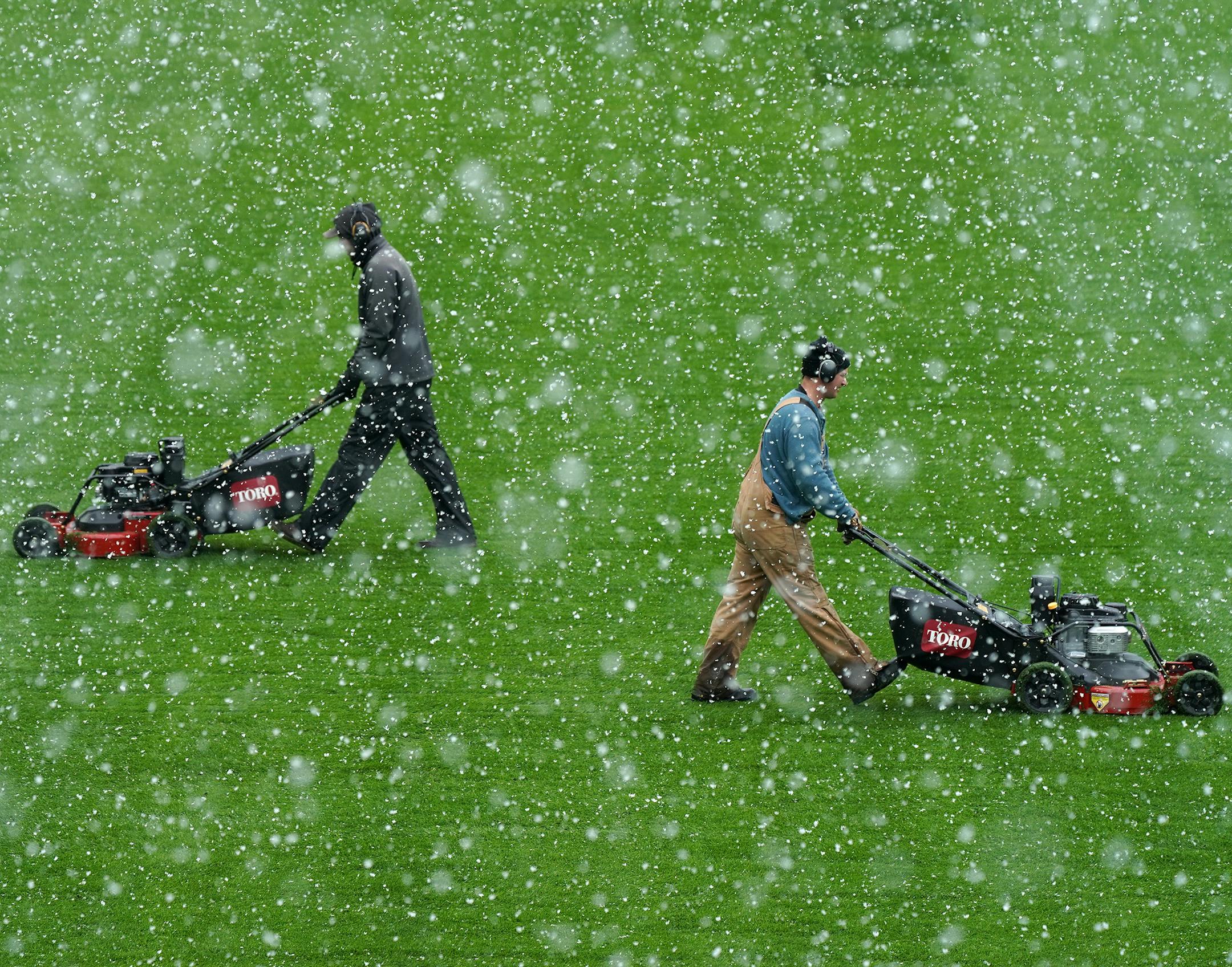 Members of the grounds crew cut the grass Friday at Allianz Field amid heavy snow flurries ahead of Saturday's home opener. ] ANTHONY SOUFFLE &#x2022; anthony.souffle@startribune.com Crews cleared snow and ice as they readied Allianz Field for Saturday's home opener against the New York City Football Club Friday, April 12, 2019 in St. Paul, Minn. ORG XMIT: MIN1904121441003030