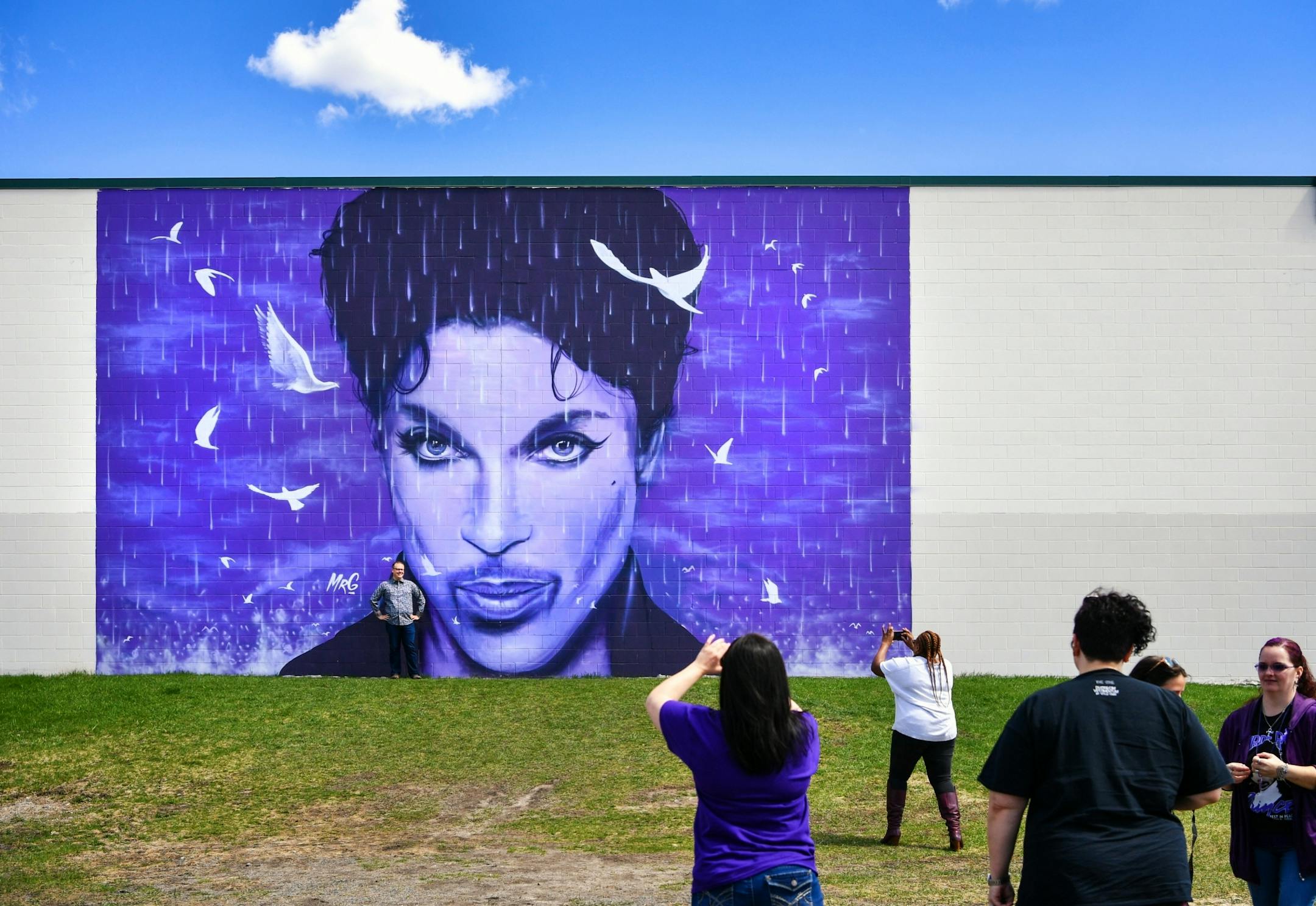 Prince fans gathered at the Prince mural on the side of the Chanhassen Cinema.