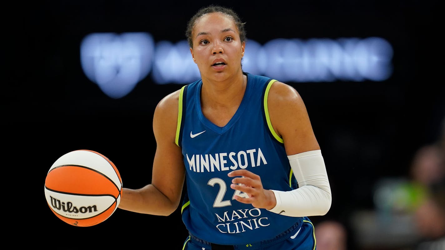 Minnesota Lynx forward Napheesa Collier dribbles down the court during the second half of a WNBA basketball game against the Seattle Storm, Tuesday, June 27, 2023, in Minneapolis. (AP Photo/Abbie Parr)