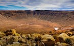 Reader Ken Evans created a photo with impact when he shot a crater with people, tiny as ants, on a viewing platform near Winslow, Ariz.