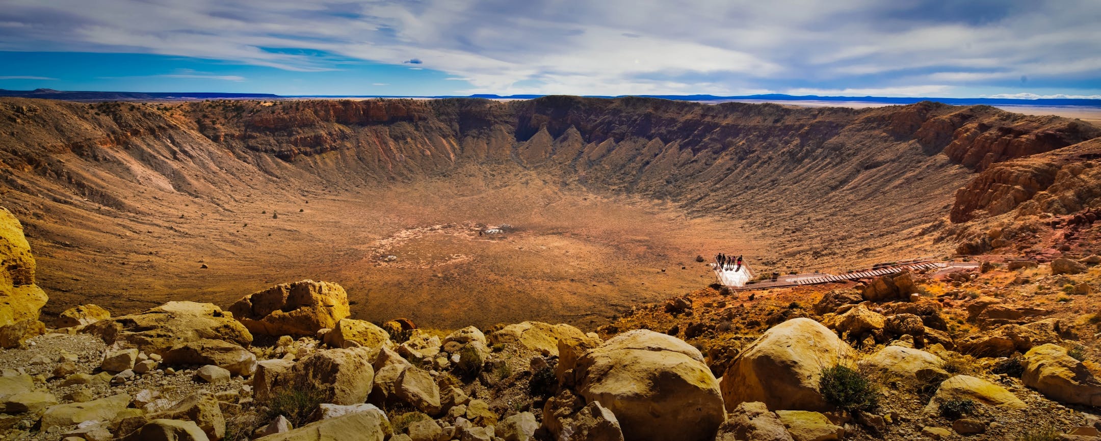 Reader Ken Evans created a photo with impact when he shot a crater with people, tiny as ants, on a viewing platform near Winslow, Ariz.