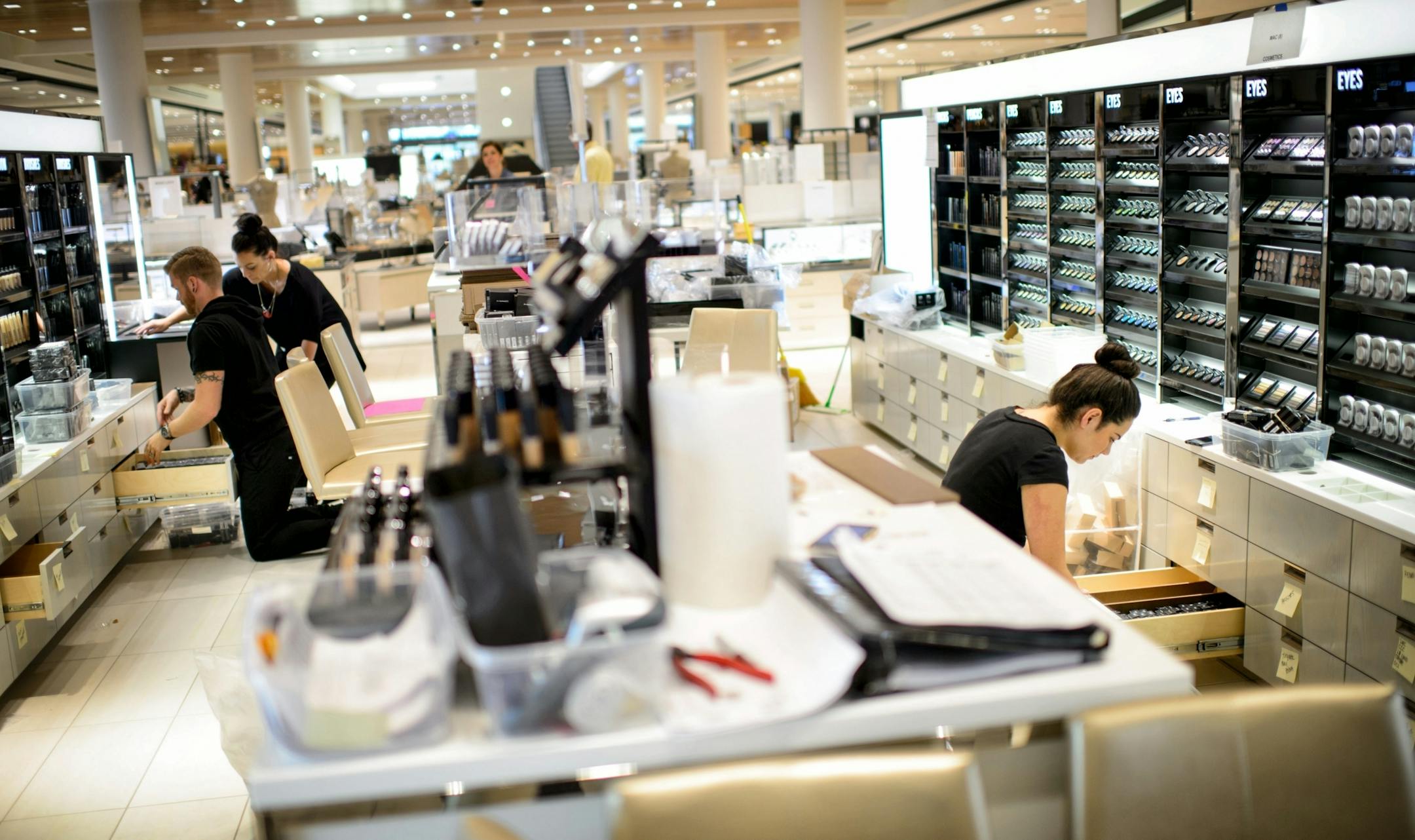 Workers from MAC Cosmetics arranged the display at the new Nordstrom open cosmetics section, Ridgedale, Minnetonka.