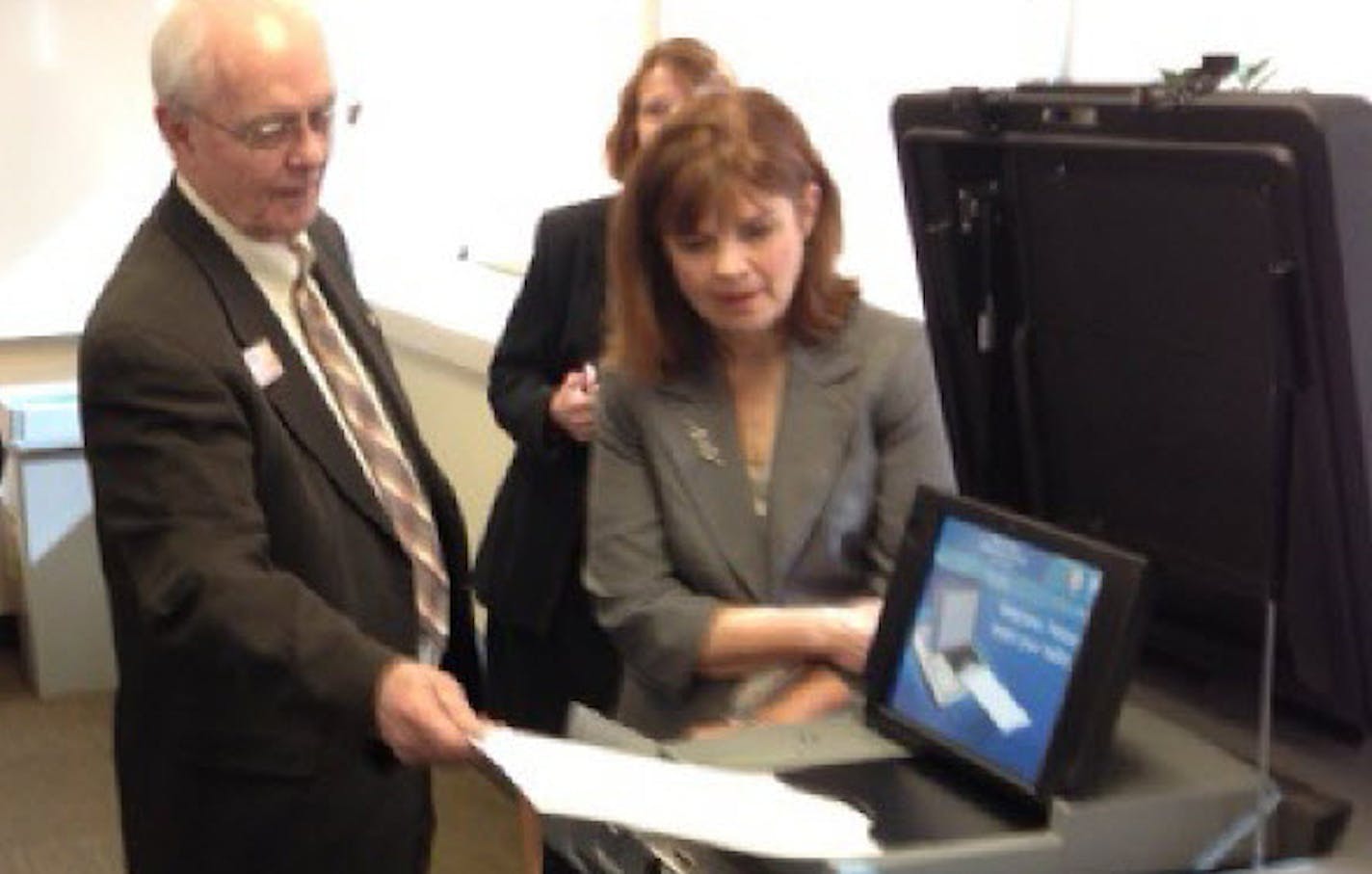 County Commissioners Lisa Weik, right, and Ted Bearth, in April 2014.