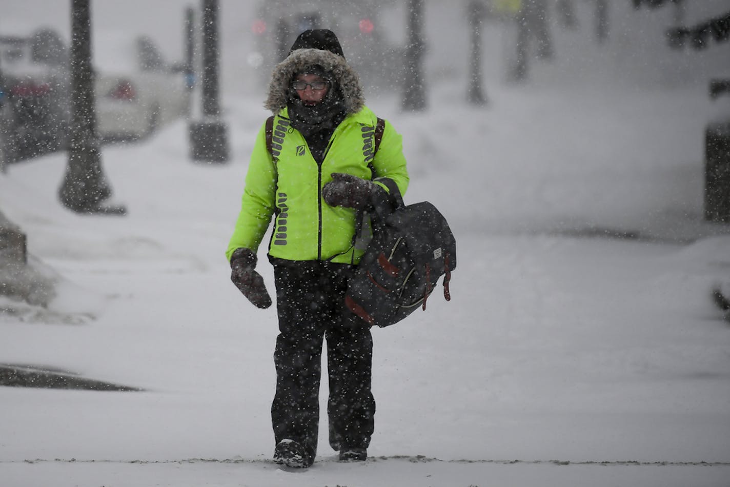 Minnesota Department of Revenue employee Vicki Coffman left work during Friday afternoon's snow storm in St. Paul.