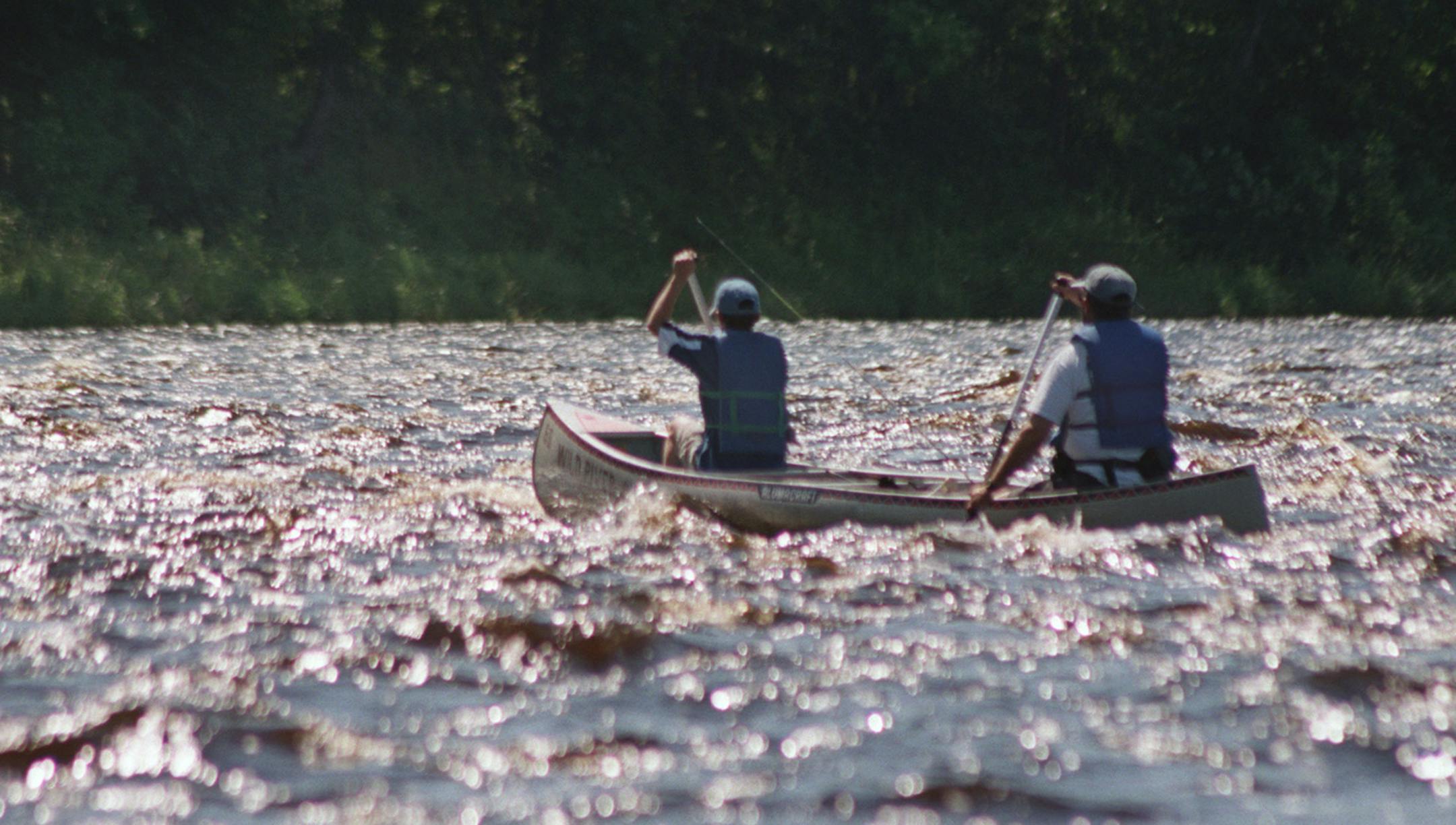 Grantsburg Wi. 8/4/99 - Canoeing and fishing the upper St Croix river. -- ORG XMIT: MIN2013072613150434