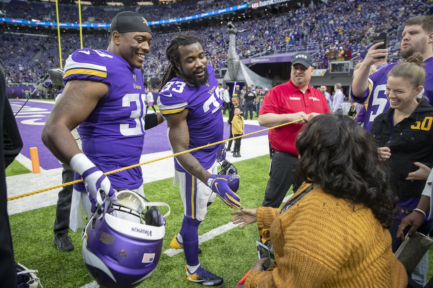 **NOT FOR USE UNTIL SPORTS CHRISTMAS DAY STORY**Minnesota Vikings fullback C.J. Ham introduced teammate running back Dalvin Cook to his mother. ] ELIZABETH FLORES &#x2022; liz.flores@startribune.com The Minnesota Vikings take on the Detroit Lions at U.S. Bank Stadium, Sunday, December 8, 2019 in Minneapolis, MN.