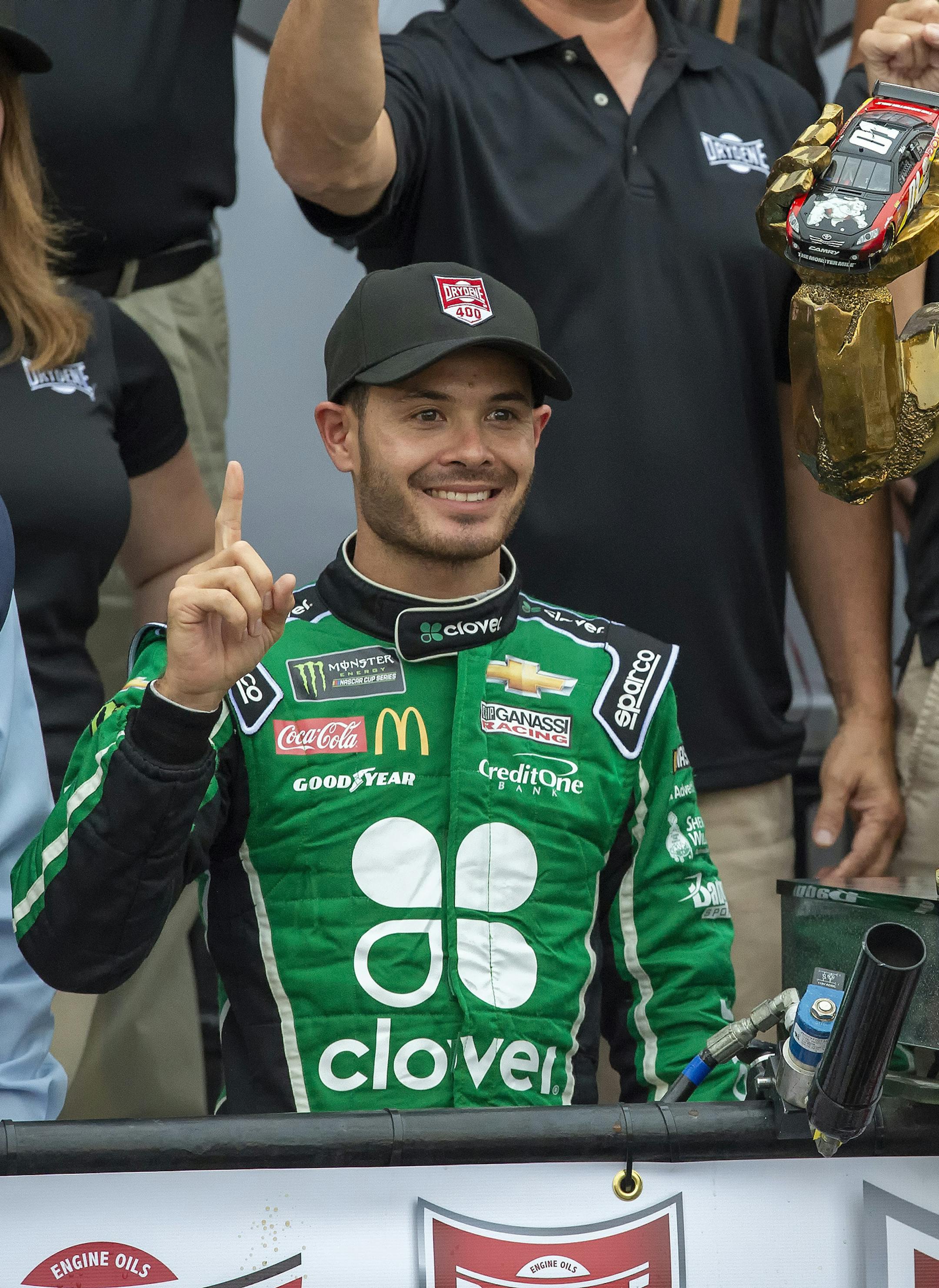Kyle Larson stands next to the trophy after winning the NASCAR Cup Series auto race Sunday, Oct. 6, 2019, at Dover International Speedway in Dover, Del. (AP Photo/Jason Minto)