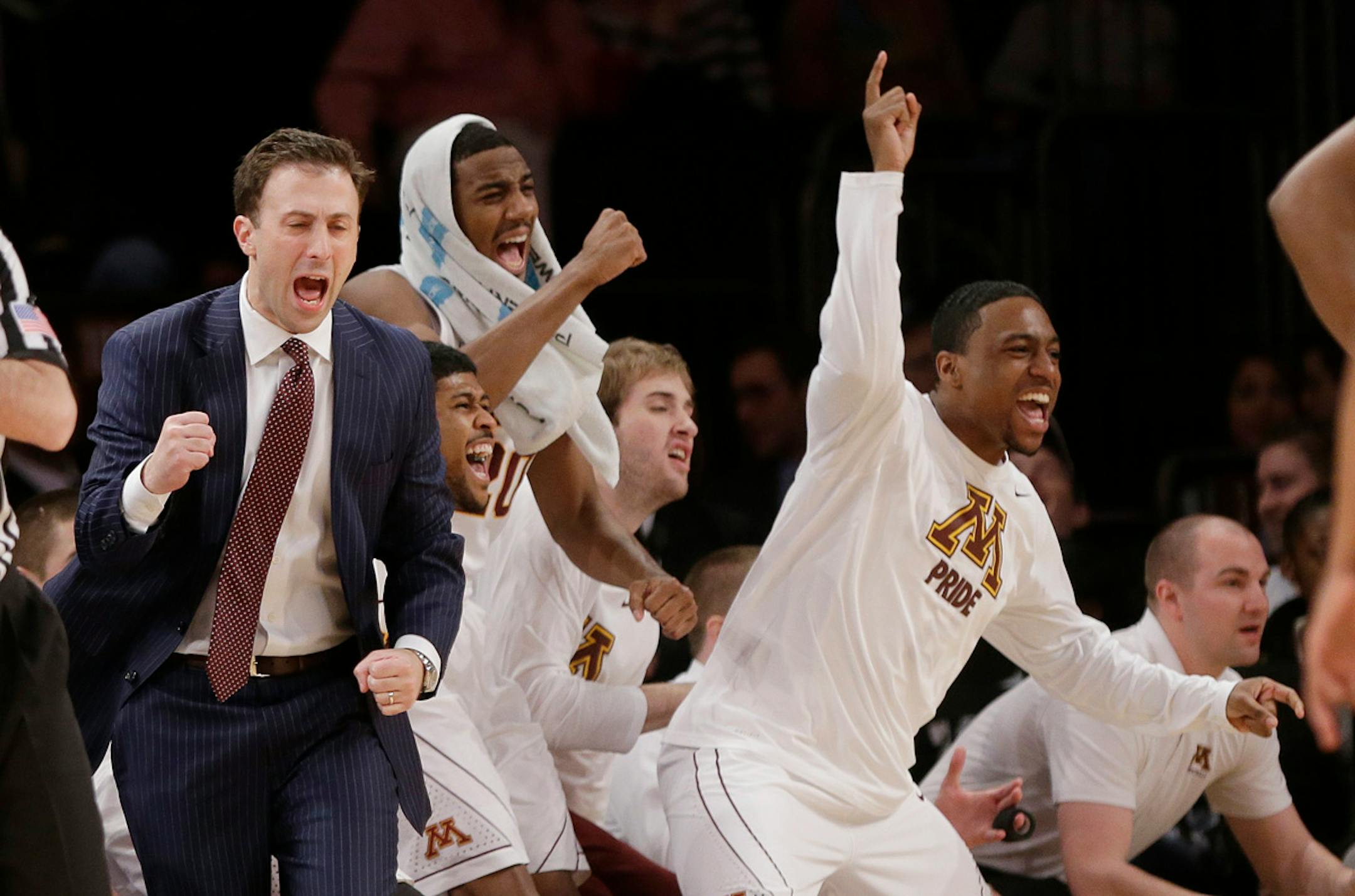 Minnesota head coach Richard Pitino reacts with his team during the first half of an NCAA college basketball game against Florida State Seminoles in the semifinals of the NIT Tuesday, April 1, 2014, in New York.