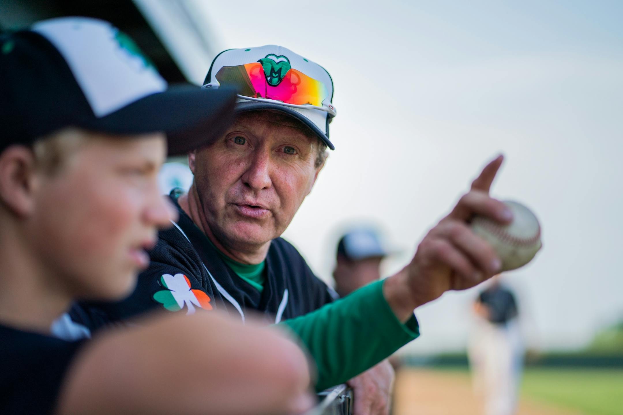 Milroy Irish manager Bob Dolan watches his team's performance against Bird Island from the dugout.