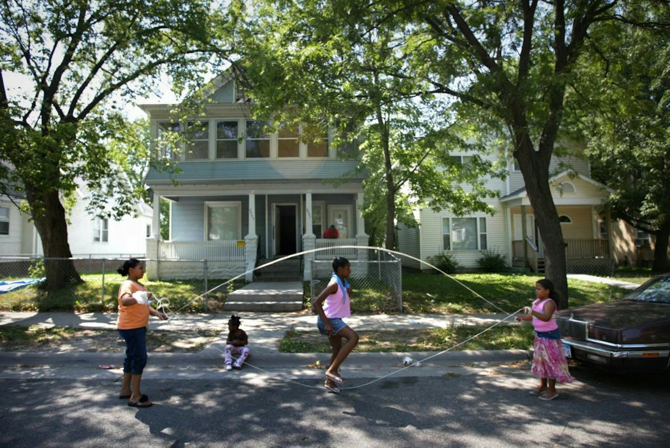 July 29, 2006: Children jump rope on 26th Street and Colfax Avenue N. on a hot Saturday afternoon. From left; Lanika Taylor, Destiny Applewhite, Rahisha Metcalf and Aireana Metcalf.