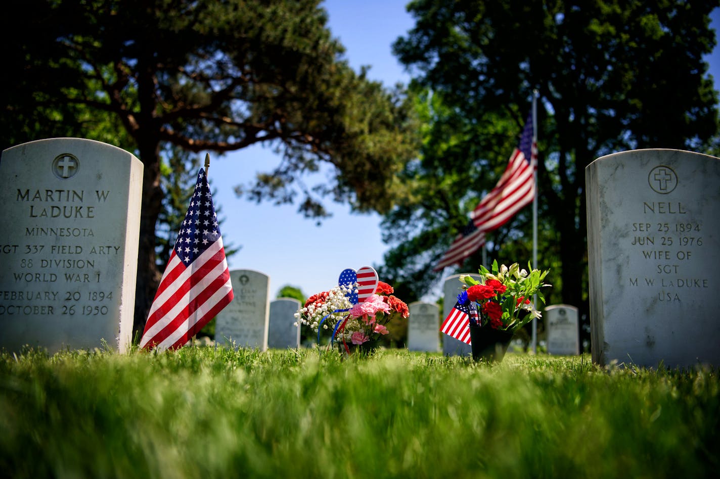 Flowers left for a loved one at Fort Snelling. ] GLEN STUBBE * gstubbe@startribune.com Thursday, May 26, 2016 Feature on Fort Snelling National Cemetery as a preview to Memorial Day. Still reporting but the idea is to focus on the groundskeepers who don't just spiff up the place for Memorial Day but take excruciating care of the burial ground every day of the year. "It's very personal for them," according to the director. More than 80 percent of those working there are vets. The grounds crew at