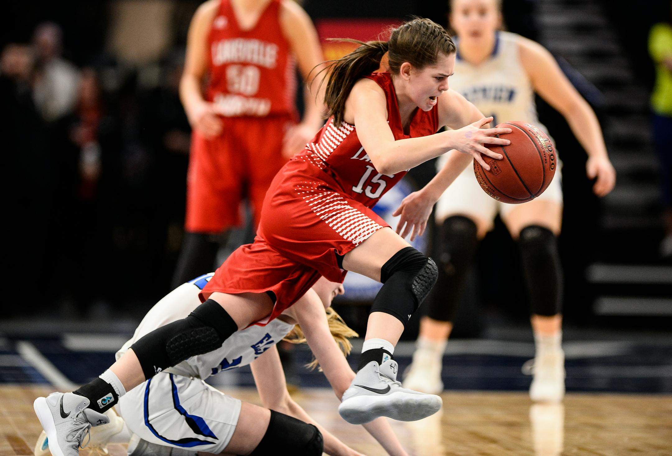 Eastview guard Cassidy Carson (25) collided with Lakeville North guard Lauren Jensen (15) in the second half, resulting in a foul call against Carson. ] AARON LAVINSKY • aaron.lavinsky@startribune.com Lakeville North played Eastview in a Class 4A semifinal game on Thursday, March 15, 2018 at Target Center in Minneapolis, Minn.