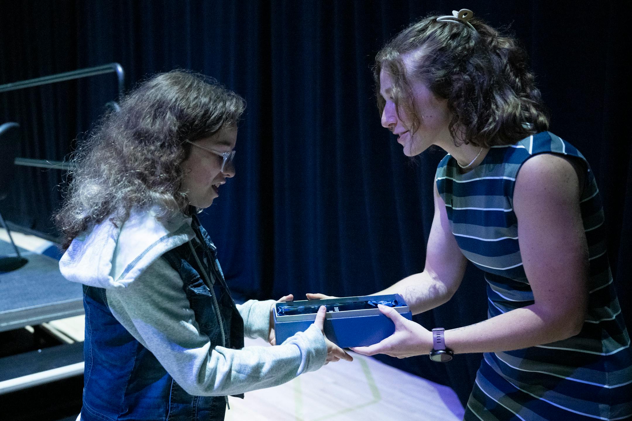 Star Tribune Event Product Manager Lauren Jimmerson hands the Difference Maker Award to Fiona Sitzmann, an adapted athlete with Dakota United, during the Star Tribune's sixth annual All-Metro Sports Awards show.