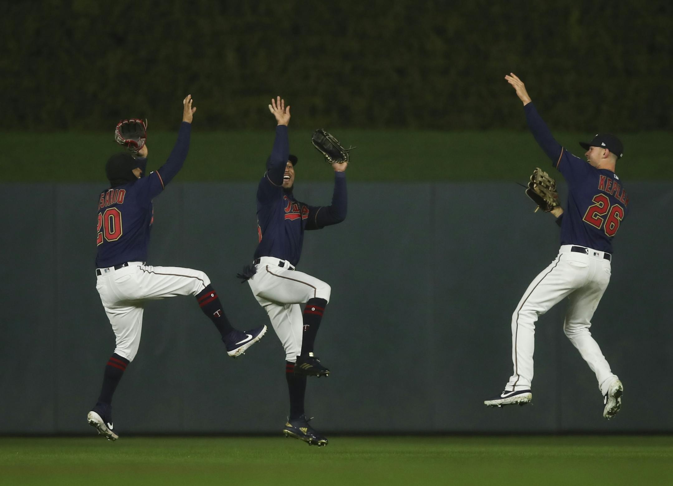 Twins left fielder Eddie Rosario (20), center fielder Byron Buxton, and right fielder Max Kepler (26) took a group jump shot to celebrate the win over the Blue Jays.