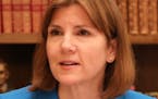Minnesota Attorney General Lori Swanson talked with her spokesperson Ben Wogsland as she reviewed evidence in the case of President Donald Trump's imm