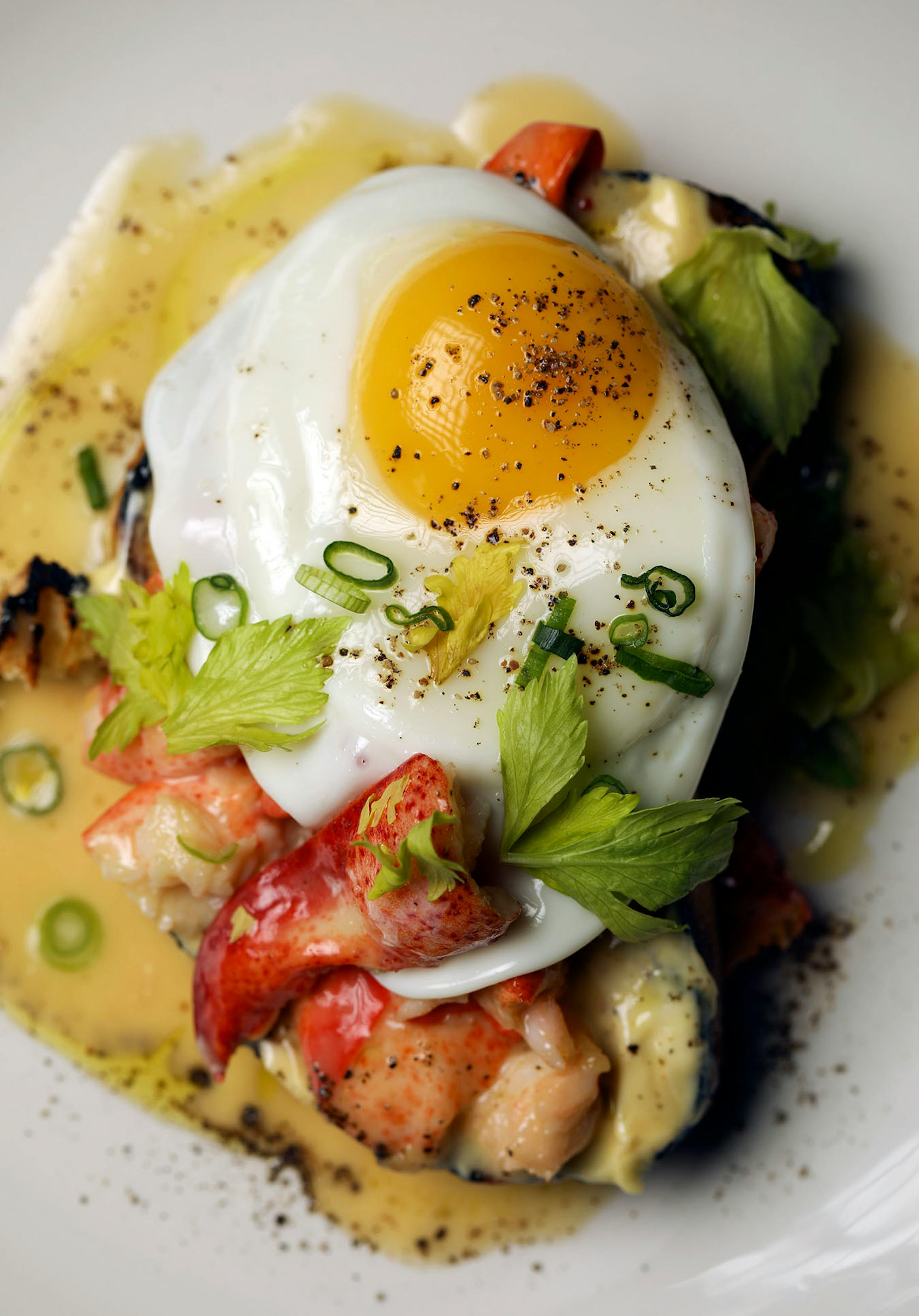 This lobster toast, with butter, fried egg, tarragon, and celery is on the brunch menu at Martina.