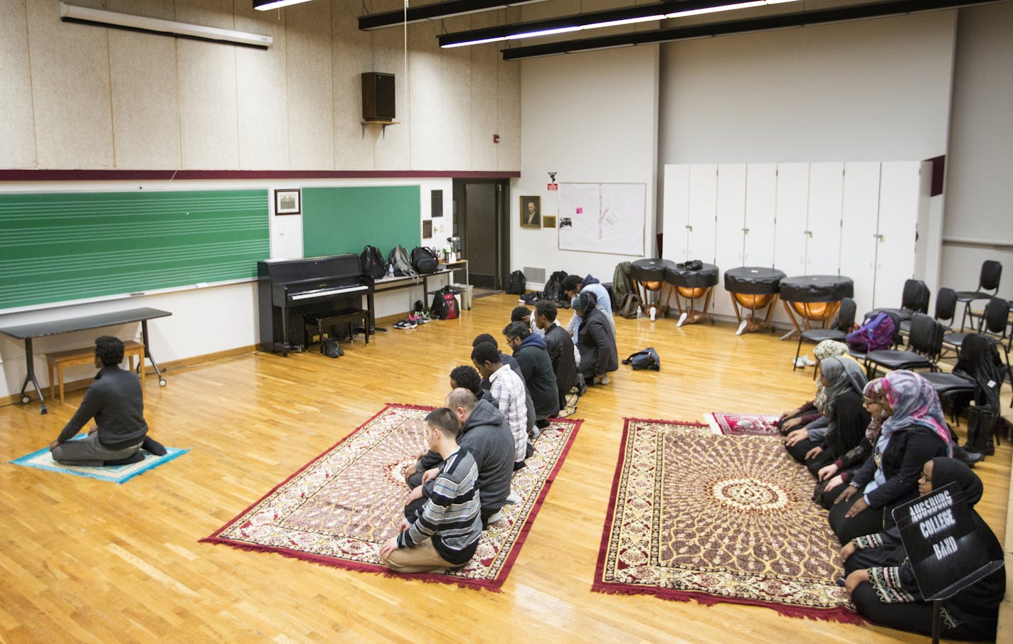 Muslim students attend a student-led Friday prayer inside a music room at Augsburg College in Minneapolis on Friday, February 19, 2016. ] (Leila Navidi/Star Tribune) leila.navidi@startribune.com