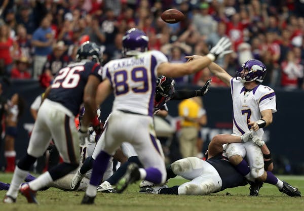 Vikings quarterback Christian Ponder threw under pressure in the fourth quarter at the Reliant Stadium in Houston, Texas.