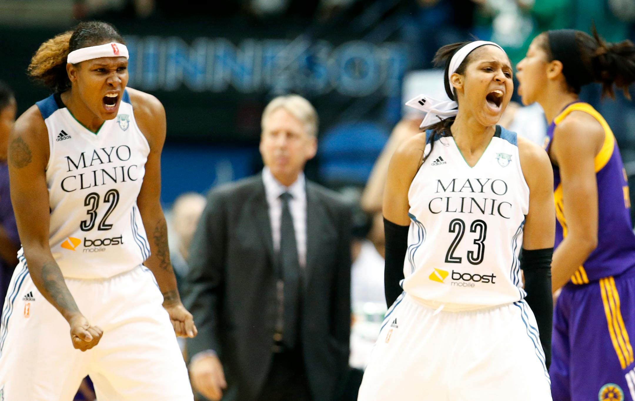 Rebekkah Brunson (32) and Maya Moore (23) of the Lynx react after a turnover by the Sparks in the final minute of Tuesday's game. Minnesota beat Los Angeles 91-80 to advance to the next round of the playoffs.