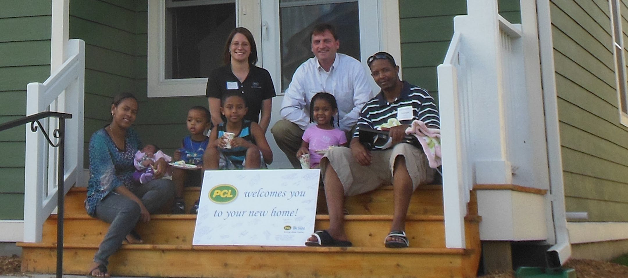 PCL Construction HR Manager Paris Otremba, District Manager Don Fromme, other employees and volunteers from Summit Academy, the North Minneapolis construction skills-training nonprofit, worked on a North Minneapolis house along with husband-and-wife Temesgen Lakew and Etagn Gudiso and their children