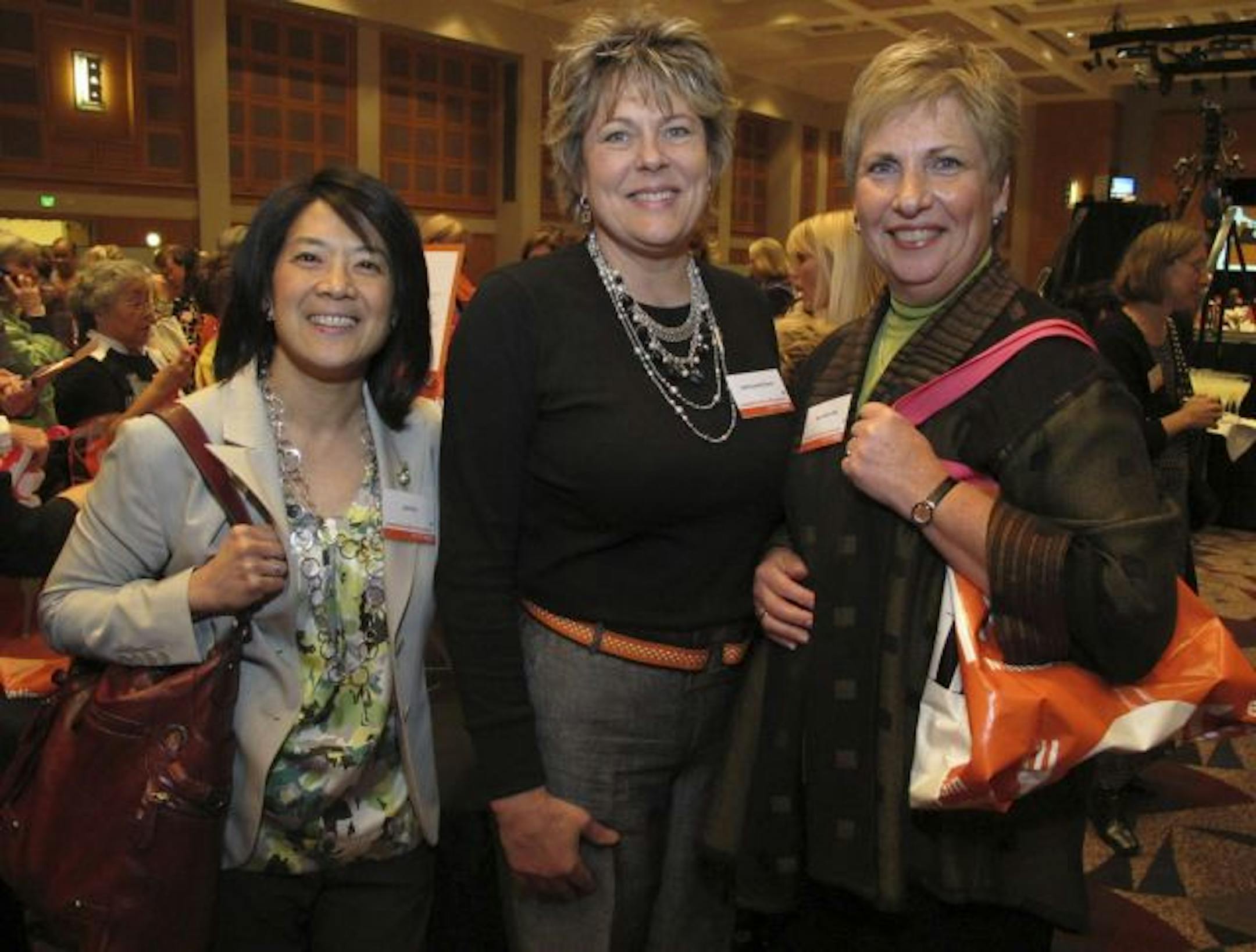 The 14th annual Circle of Women luncheon for YWCA of Minneapolis. Laura Liu, designer Heidi Comfort and Myrna Marofsky