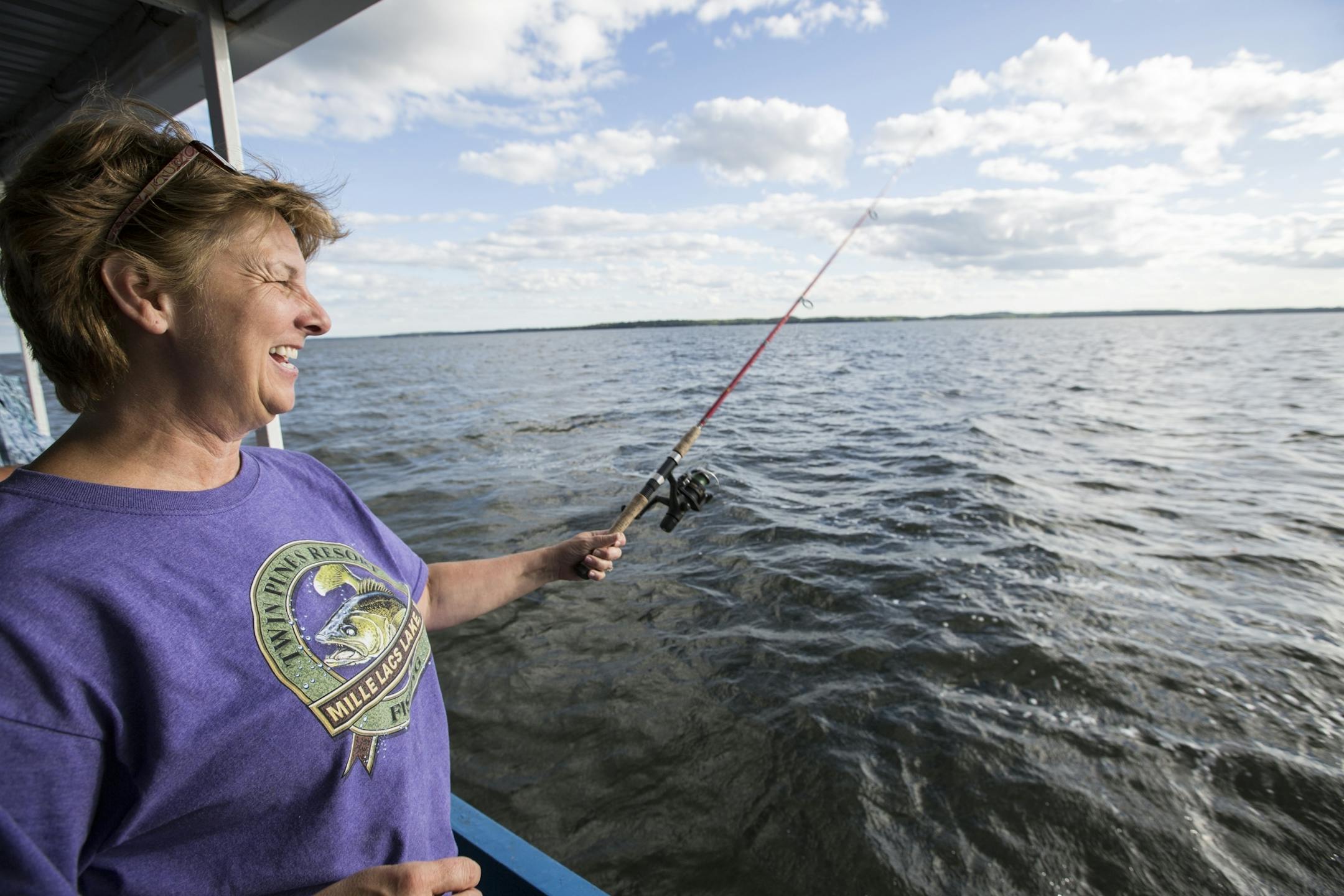 Twin Pines Resort co-owner Linda Eno fishes during one other resort's fishing expeditions on Mille Lacs Lake Monday, August 3, 2015.
