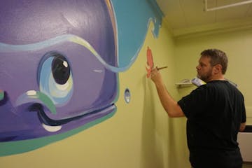 Provided
Greg Preslicka, an artist from Savage, donates his time and talent to paint murals for children whose days could use a little brightening. Hi