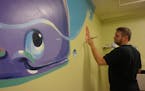 Provided
Greg Preslicka, an artist from Savage, donates his time and talent to paint murals for children whose days could use a little brightening. Hi