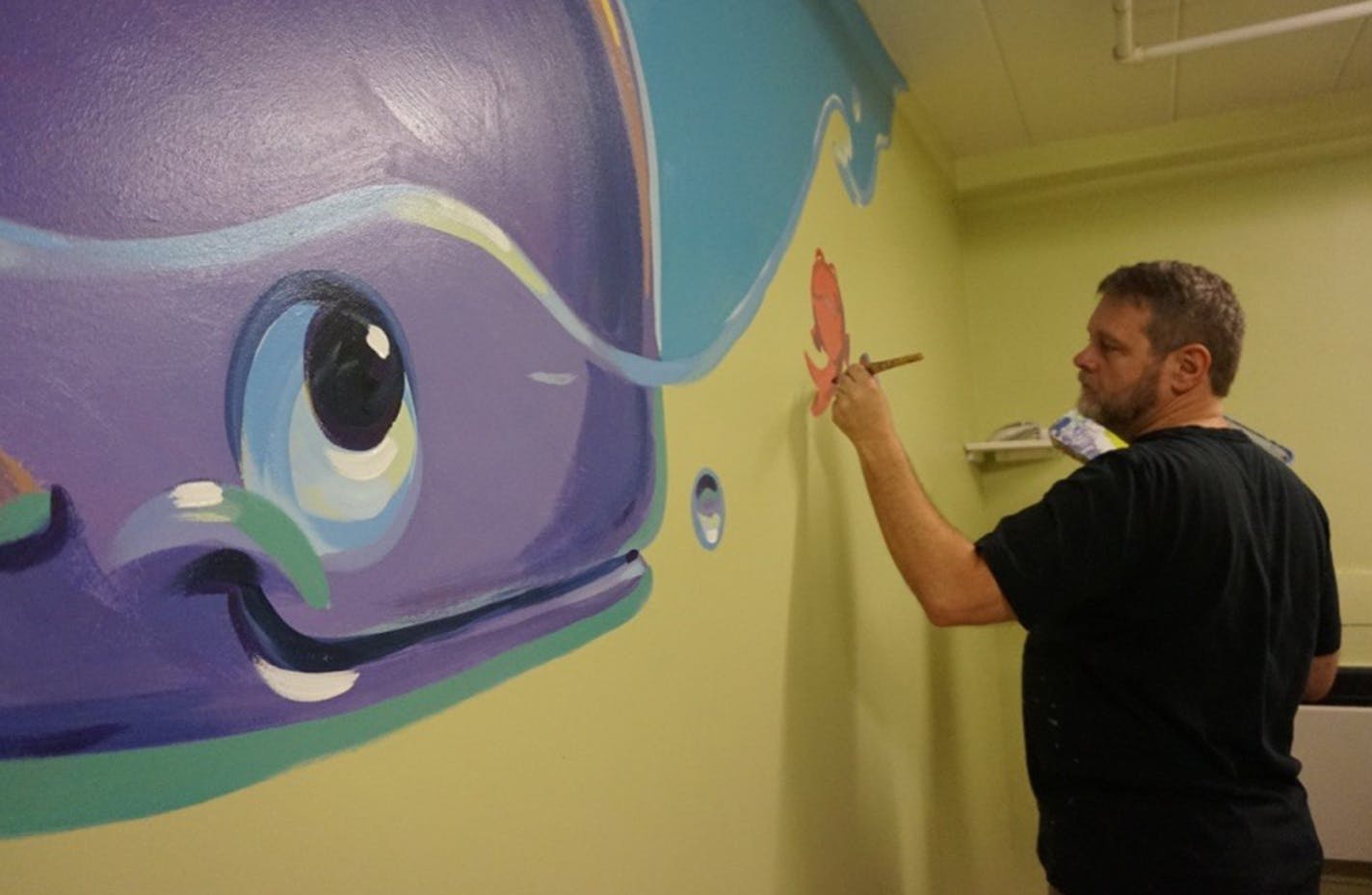 Provided
Greg Preslicka, an artist from Savage, donates his time and talent to paint murals for children whose days could use a little brightening. His latest: murals that adorn the bedroom walls at the Greater Minneapolis Crisis Nursery.