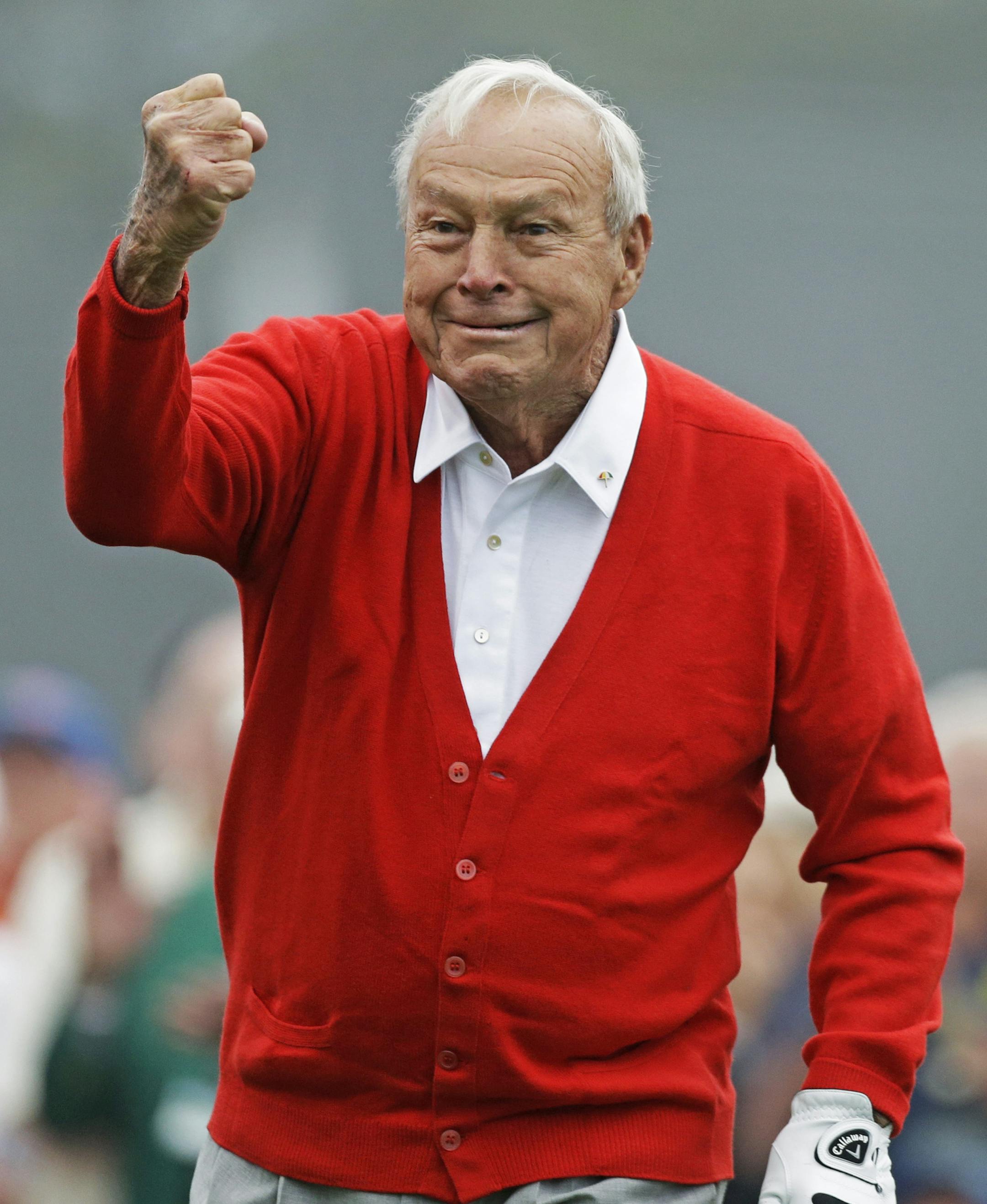 Honorary starter Arnold Palmer punches the air after hitting off the first tee before the first round of the Masters golf tournament Thursday, April 11, 2013, in Augusta, Ga. (AP Photo/David Goldman)