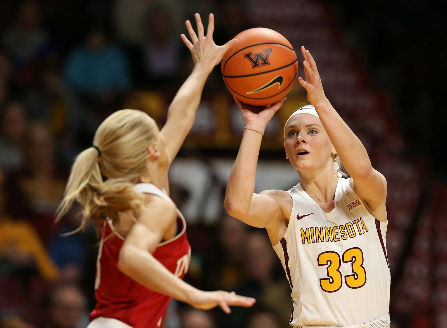 Minnesota Golden Gophers guard Carlie Wagner (33) hit a three pointer over Indiana Hoosiers guard Tyra Buss (3) at Williams Arena Tuesday Feb 20, 2018 in Minneapolis, MN.] Minnesota hosted Indiana at Williams Arena . JERRY HOLT &#xef; jerry.holt@startribune.com ORG XMIT: MIN1802202136473130