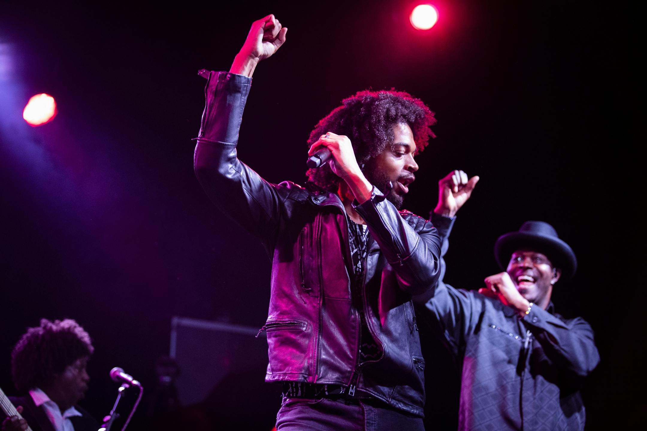 MacKenzie sings lead vocals, with Damon Dixon at right, during the New Power Generation show.