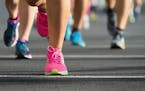 Marathon running race, people feet on city road
istock