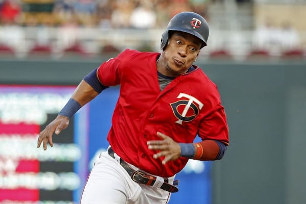 Minnesota Twins' Jorge Polanco rounds third base en route to scoring against the Chicago White Sox on a single by Nelson Cruz in the first inning of a