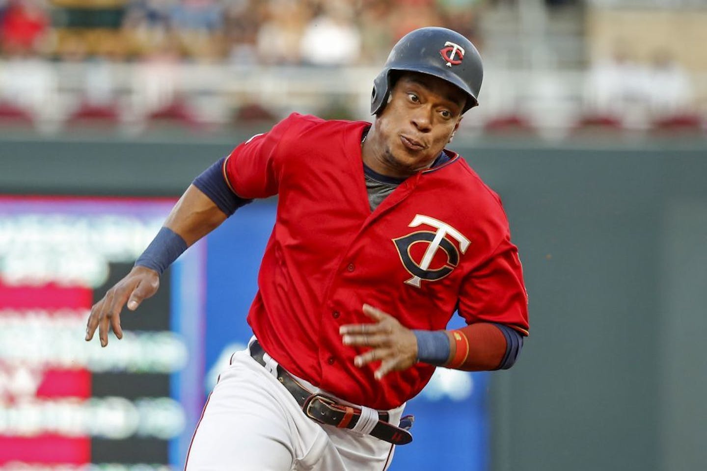 Minnesota Twins' Jorge Polanco rounds third base en route to scoring against the Chicago White Sox on a single by Nelson Cruz in the first inning of a baseball game Monday, Aug 19, 2019, in Minneapolis.