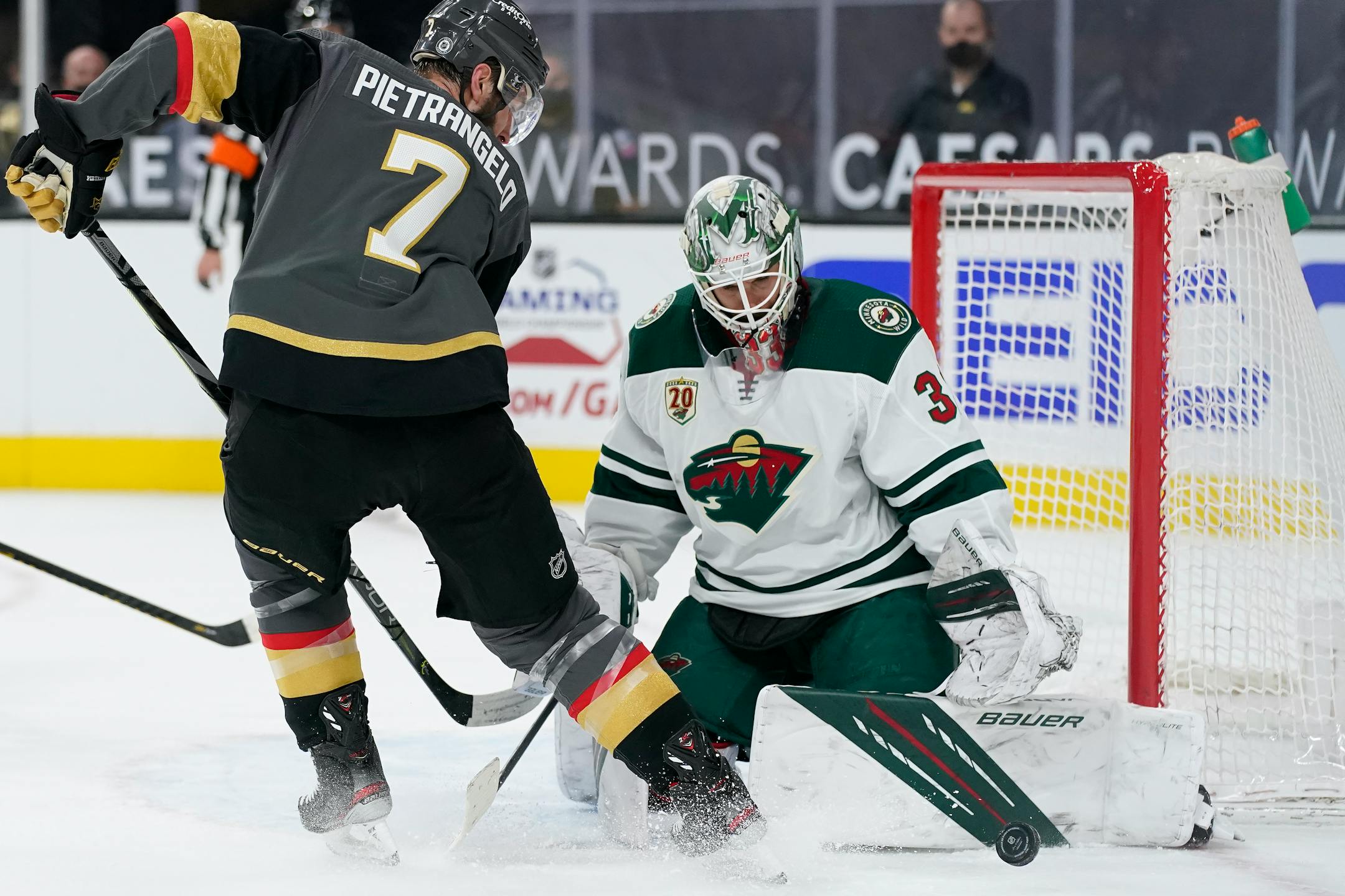 Wild goaltender Cam Talbot blocks a shot by Vegas defenseman Alex Pietrangelo during overtime on Thursday