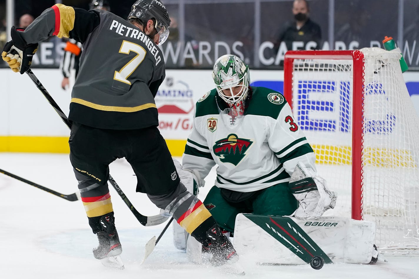 Wild goaltender Cam Talbot blocks a shot by Vegas defenseman Alex Pietrangelo during overtime on Thursday