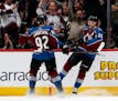Colorado Avalanche left wing Gabriel Landeskog, left, celebrates with center Nathan MacKinnon after his goal against the Minnesota Wild in the second 