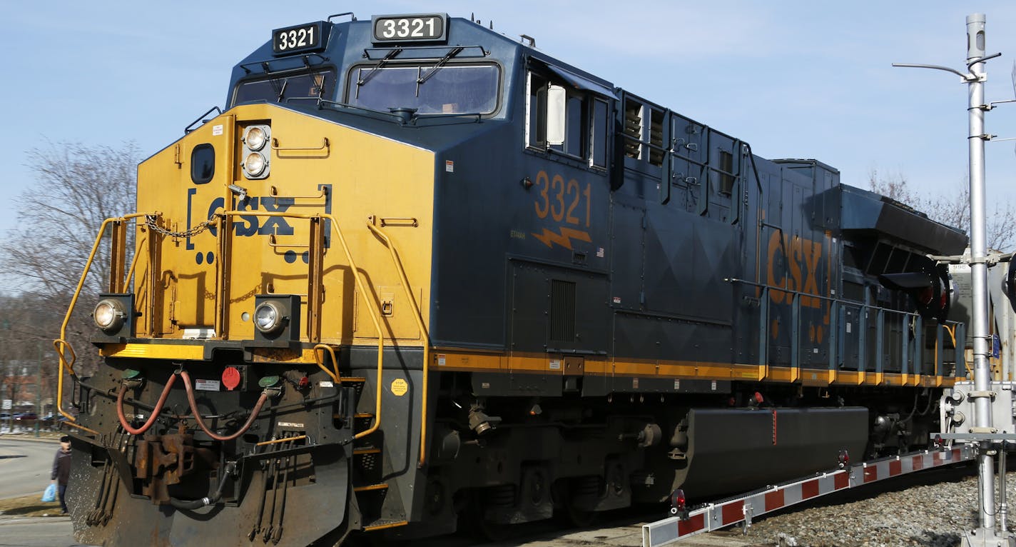 FILE- In this Feb. 12, 2018, file photo, a CSX freight train passes through Homestead, Pa. CSX railroad will give investors another update on its efforts to cut costs and improve efficiency when it releases its quarterly earnings report on Tuesday, July 17, 2018. (AP Photo/Gene J. Puskar)