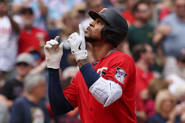 Minnesota Twins' Byron Buxton reacts after hitting a home run during the fifth inning of a baseball game against the Cleveland Guardians, Sunday, May 