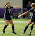 Mahtomedi forward Lauren Heinsch (9), left, celebrated her goal with Mahtomedi forward Anna Wagner (22) during the first half.