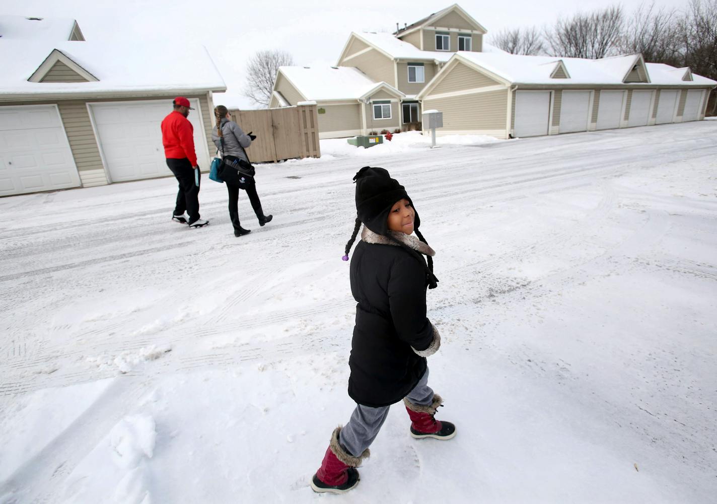 Kendrick Bates walked with apartment agent Courtney Urman to look at a house in New Richmond, Wis., as his 6-year-old daughter, Charisse, spied some playground equipment. Even with a voucher, Bates could not find a suitable place to live in the Twin Cities.